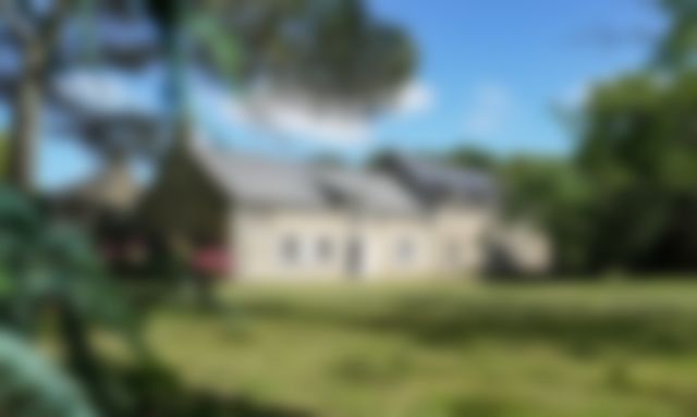 Full front view of the main house, blurred